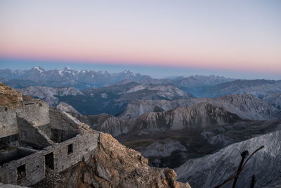 Scenic view of mountains against sky during sunset