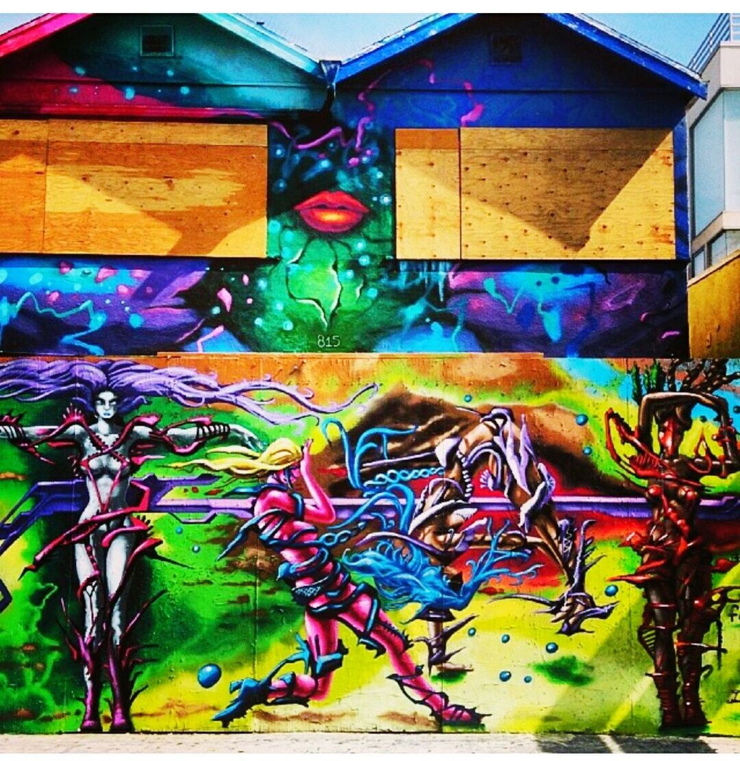 multi colored, graffiti, art, creativity, art and craft, architecture, built structure, wall - building feature, colorful, indoors, street art, design, building exterior, pattern, mural, blue, wall, painting, yellow, day