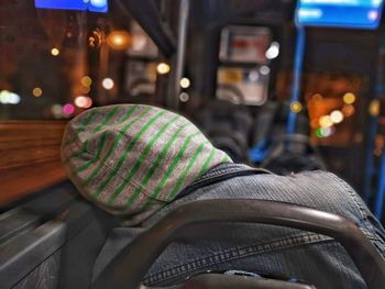 Rear view of man sitting in bus