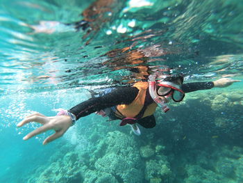 Woman snorkeling in sea