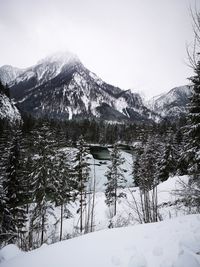 Scenic view of snow covered mountains against sky