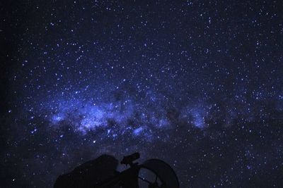 Low angle view of star field against sky