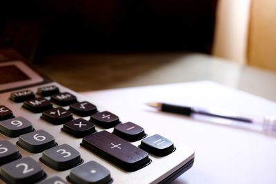 Close-up of calculator on table