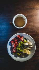 Directly above shot of fruit salad in bowl on table