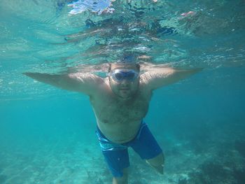 Portrait of man swimming in sea