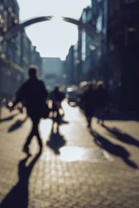 People walking on street in city