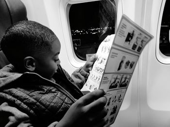 Close-up of boy playing in airplane