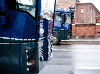 Vehicles on road along buildings