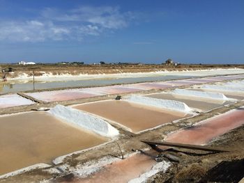 Salt basin against sky