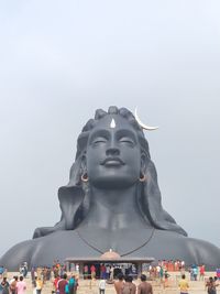 Low angle view of statue against sky