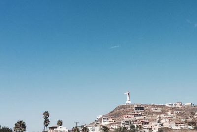 Low angle view of monument against blue sky