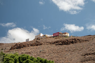 Low angle view of built structure on land against sky