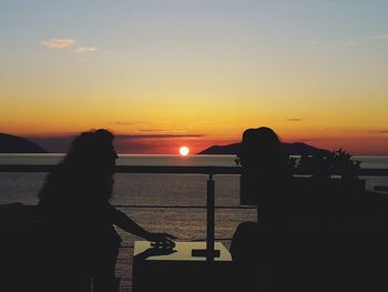 Scenic view of sea at sunset