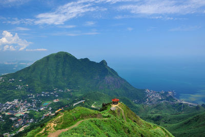 High angle view of mountain and sea against sky