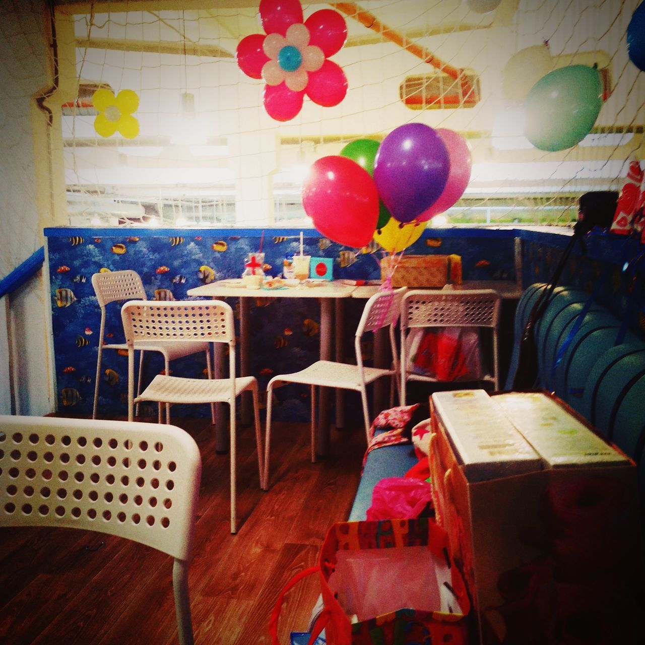 indoors, table, hanging, chair, still life, variation, large group of objects, decoration, arrangement, multi colored, red, absence, no people, paper, wood - material, choice, high angle view, day, text, restaurant