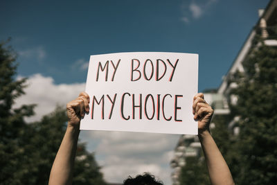 Woman holding a sign my body, my choice