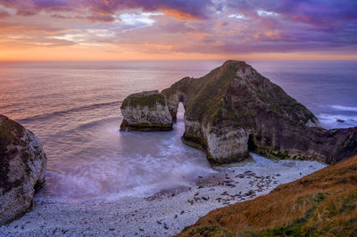 Sea arch at flamborough head on the yorkshire coast known as the drinking dinosaur.