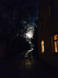 Illuminated building against sky at night