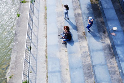 High angle view of people standing on staircase