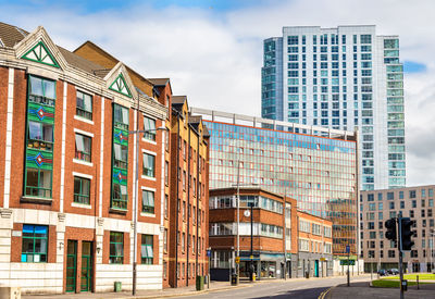 Low angle view of buildings against sky in city