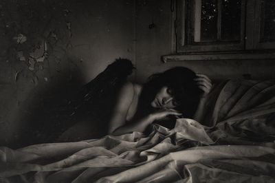 Woman sleeping on bed