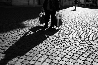 Low section of person walking on footpath