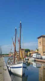 Boats moored at harbor