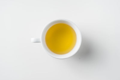 Directly above shot of tea cup against white background