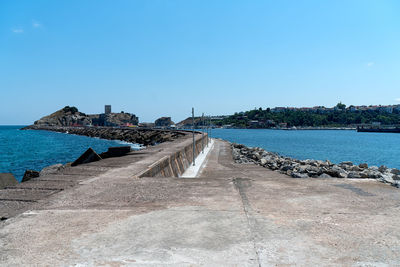 Scenic view of sea against clear blue sky