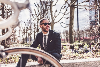 Young man sitting on bicycle