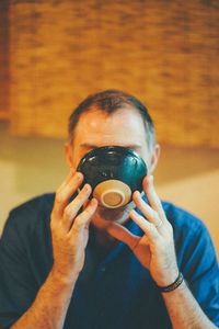 Portrait of a man drinking coffee