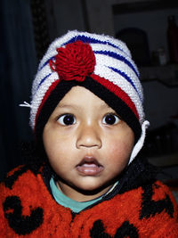 Close-up portrait of cute girl in hat