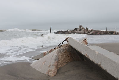 Built structure at beach against sky