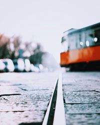Surface level of train on railroad track against sky