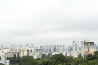 Buildings in city against sky