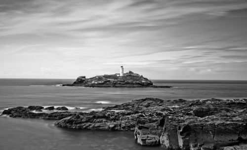 Scenic view of sea against cloudy sky