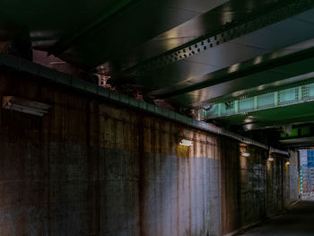 Low angle view of illuminated bridge in building