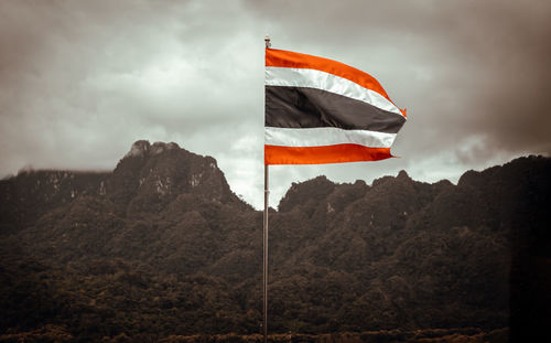 Low angle view of flag against sky