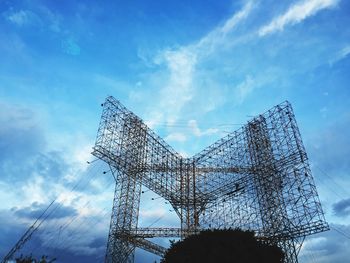 Low angle view of cables against blue sky