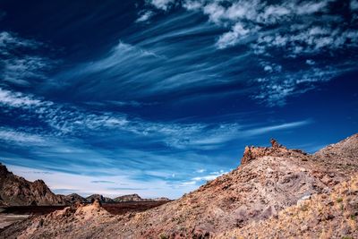 Low angle view of rock formations against sky