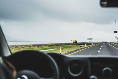 Road seen through car windshield