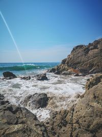 Scenic view of sea against blue sky