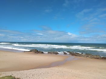 Scenic view of beach against sky