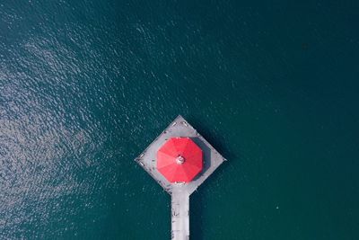 High angle view of red floating on sea