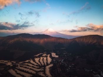 High angle view of mountains against sky during sunset