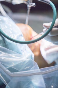 Close-up of medical equipment in wounded knee in operating room