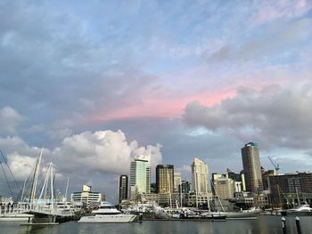 Sea and cityscape against sky