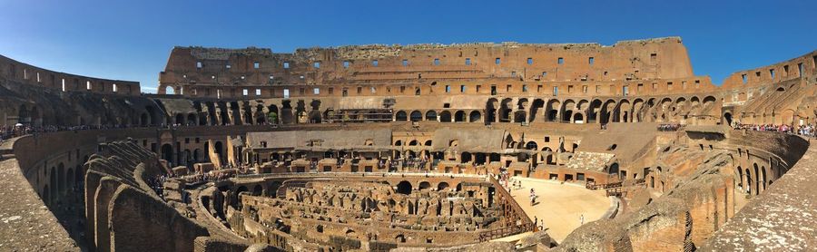 Low angle view of old colosseum in rome against sky