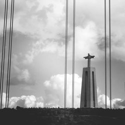 Low angle view of statue against sky