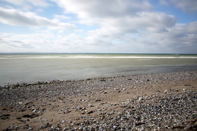 Scenic view of beach against sky